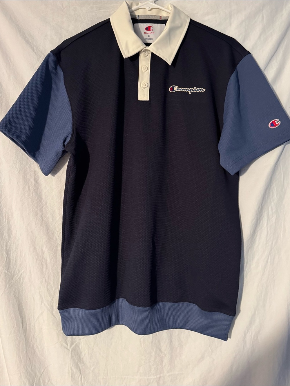 Champion Black Polo with Blue Sleeves and Cream Collar